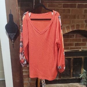 Vibrant Orange V-Neck Blouse with Patterned Sleeves